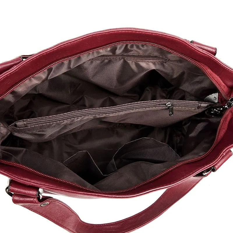 Elegant Burgundy Leather Handbag with Silver Accents
